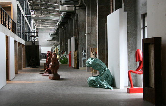 A sulpture showcased inside an abandoned workshop of Red Town, Shanghai. [Photo by Wang Zhiyong/China.org.cn]