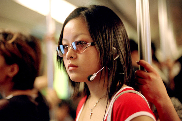 13 A young girl walks through the subway station 