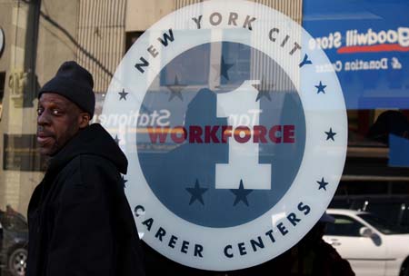 A man walks past the New York State Department of Labor in Bronx of New York, March 12, 2009. With layoffs spreading, the number of initial claims for jobless benefits rose last week, while the total number of people continuing to receive benefits set a record high, the government said Thursday. [Xinhua]