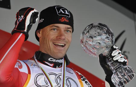 Michael Walchhofer of Austria celebrates winning the men's downhill trophy after the season's last downhill race at the Alpine Skiing World Cup Finals in Are March 11, 2009.
