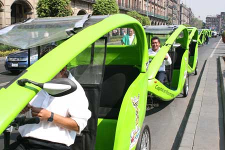 Taxi drivers wait for passengers in central Mexico City, capital of Mexico, on March 11, 2009. The Mexican government launched a program of operating low exhaust taxis to improve the environment in the capital city.