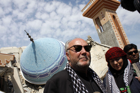 British lawmaker George Galloway (L) inspects the rubble of an Islamic school destroyed during January's Israeli military offensive in Rafah, southern Gaza Strip, March 11, 2009. An aid caravan headed by Galloway, carrying food, clothing and medicine entered Gaza from Egypt on Monday through Egypt's Rafah border crossing. 