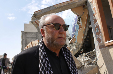 British lawmaker George Galloway inspects the rubble of an Islamic school destroyed during January's Israeli military offensive in Rafah, southern Gaza Strip, March 11, 2009. An aid caravan headed by Galloway, carrying food, clothing and medicine entered Gaza from Egypt on Monday through Egypt's Rafah border crossing.