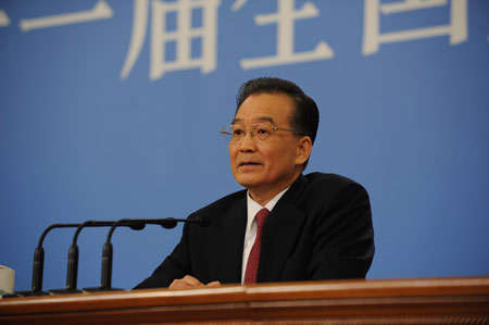 Chinese Premier Wen Jiabao answers questions during a press conference after the closing meeting of the Second Session of the 11th National People's Congress (NPC) at the Great Hall of the People in Beijing, capital of China, March 13, 2009. The annual NPC session closed on Friday.