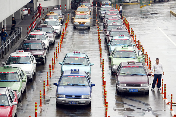 Taxis line up outside the air terminal of Shanghai Hongqiao International Airport