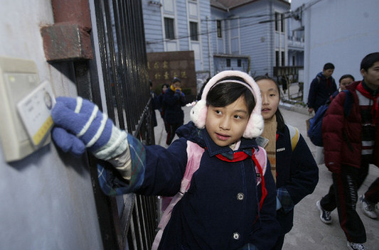 Homebound students at a school gate. 