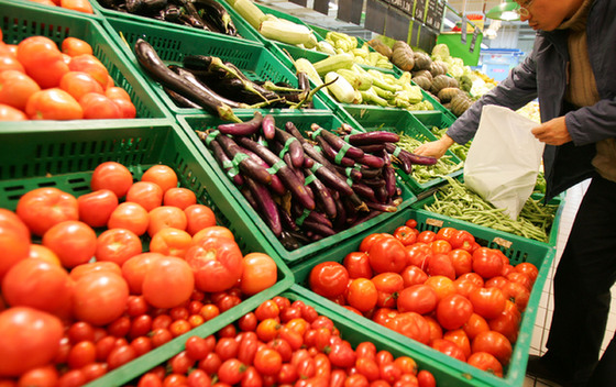 People in Shanghai buying vegetables. 