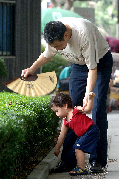 Old people and children in a park 