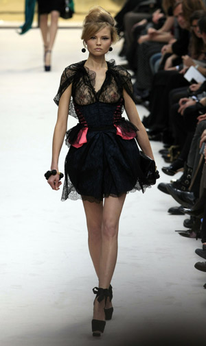 A model wears a creation by designer Marc Jacobs for Louis Vuitton
