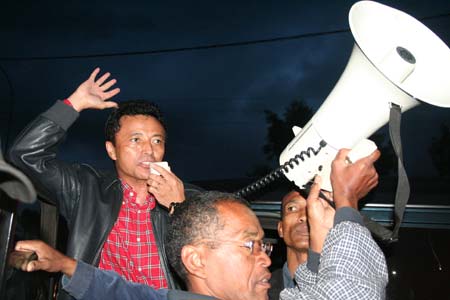 Madagascar's President Marc Ravalomanana (L) claims he is still legitimate president during a rally outside presidential palace in Antananarivo, capital of Madagascar, on Mar. 14, 2009. [Xinhua]