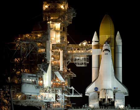 Space shuttle Discovery sits on launch pad 39A as rotating service structure rolls back at the Kennedy Space Center in Cape Canaveral, Florida 2009.[Xinhua/Reuters]