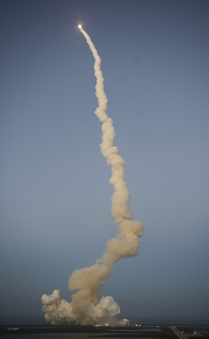 The US Space Shuttle Discovery lifts off, on March 15, at Kennedy Space Center in Florida. Discovery's flight is delivering the space station's fourth and final set of solar array wings, completing the station's truss, or backbone.[Xinhua/AFP]