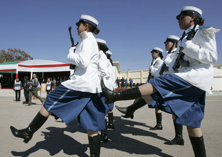 Newly graduated female members of a police special unit march during their graduation ceremony at the police academy in Ain Benian, Algiers, March 15, 2009. [Xinhua/Reuters]