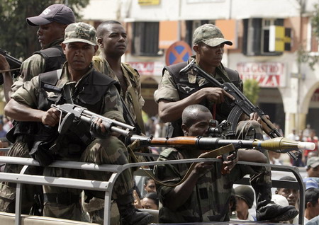 Madagascar's military drive through the streets of Antananarivo at the end of a rally organised by opposition leader Andry Rajoelina March 16, 2009. [China Daily/Agencies]