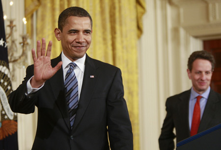 U.S. President Barack Obama (L) and Treasury Secretary Timothy Geithner arrive in the East Room of the White House in Washington March 16, 2009 to make announcements on helping small business during the economic crisis. [Xinhua]