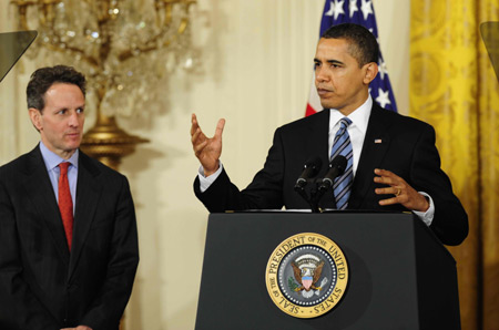 U.S. President Barack Obama (R), accompanied by Treasury Secretary Timothy Geithner, delivers remarks to small business owners, community lenders and members of Congress at the White House in Washington on March 16, 2009. The Obama administration on Monday unveiled a plan to help unlock credit for the nation's small businesses, which generate about 70 percent of net new jobs annually. [Xinhua]