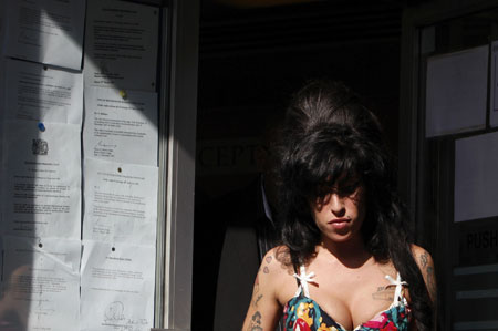 British singer Amy Winehouse leaves the City of Westminster Magistrates Court in central London March 17, 2009. Winehouse appeared in court on Tuesday and denied a charge of assaulting a woman after a charity ball in London last year. [Xinhua/Reuters]