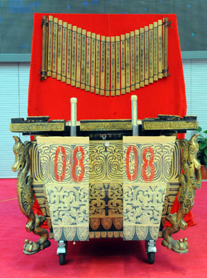 Photo taken on March 18, 2009 shows a sample of 'Fou' (Bottom), or drums, and that of 'Zhujian' (Top), or bamboo strolls at the auction conducted by China Beijing Equity Exchange (CBEX) selling 'Fou' drums and 'Zhujian' scrolls used in the opening ceremony of the Beijing Olympic Games in Beijing, capital of China.[Xinhua]