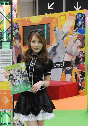 A showgirl smiles at the Tokyo International Anime Fair, Japan, March 18, 2009. Some 250 Japanese and foreign companies exhibited their latest animations during the Tokyo International Anime Fair, opened on Wednesday. [Hua Yi/Xinhua]