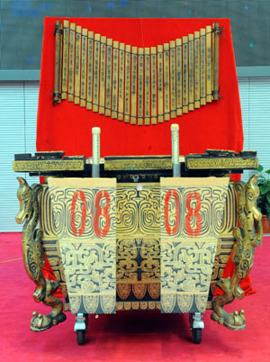 Photo taken on March 18, 2009 shows a sample of 'Fou' (Bottom), or drums, and that of 'Zhujian' (Top), or bamboo strolls at the auction conducted by China Beijing Equity Exchange (CBEX) selling 'Fou' drums and 'Zhujian' scrolls used in the opening ceremony of the Beijing Olympic Games in Beijing, capital of China. [Xinhua] 