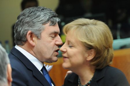 Britain's Prime Minister Gordon Brown (L) greets German Chancellor Angela Merkel during the first day meeting of EU spring summit in Brussels, capital of Belgium, March 19, 2009. [Wu Wei/Xinhua]