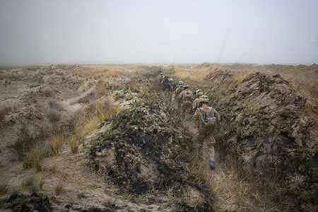 A handout photograph from the Royal marines shows members of 42 Commando during Operation Aabi Toorah (Blue Sword) in Helmand province in southern Afghanistan in an image released March 19, 2009. [Xinhua/Reuters]