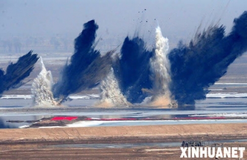 Dynamite is dropped to remove the ice blockages along a section of the Yellow River in Dalad, about 20 km downstream from Hujiatuodan, March 18, 2009.