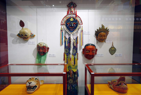 Tibetan opera masks are seen in the Exhibition of Essence of Tibetan Intangible Cultural Heritage in Macao, south China, on March 20, 2009. The five-day exhibition was opened here on Friday, displaying 99 exhibits that are of Tibetan cultural importance. 