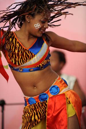 A dancer from Madagascar performs during the 2009 (13th) Nanjing Tourism Expo in Nanjing, capital city of east China's Jiangsu Province, March 21, 2009. 