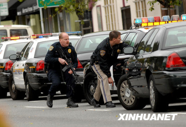 Three police officers were killed and a fourth one brain dead in two shootings that took place at a routine traffic stop and after a massive manhunt for a man wanted for violating his parole in east Oakland on March 22. [Xinhua]