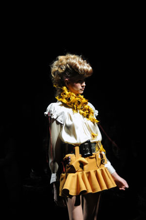 A model shows a one-piece dress designed by Motonari Ono at the first day of the 8th Tokyo Fashion Week in Tokyo, capital of Japan, Mar. 23, 2009.[Chen Xi/Xinhua]