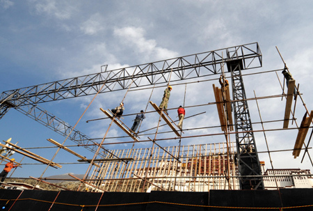 Workers set up the structure of a rostrum in Lhasa, capital of southwest China's Tibet Autonomous Region, March 22, 2009. Celebrations will be held on March 28 in Lhasa to mark the first Serfs Emancipation Day, which falls on March 28.