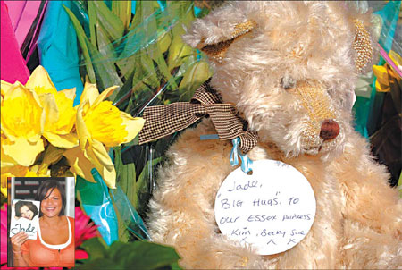 Flowers and a teddy bear with a message are left at the house of Jade Goody in Upshire, Essex, southern England, yesterday. Inset: Jade Goody with her autobiography, in a London bookstore, on May 3, 2006. 