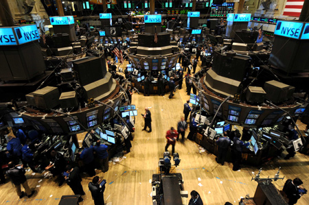  Traders work on the floor of the New York Stock Exchange March 23, 2009. [Xinhua]