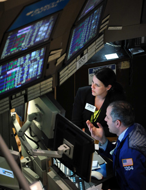 Traders work on the floor of the New York Stock Exchange March 23, 2009. [Xinhua]