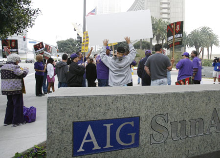 Protesters gather outside the AIG building in Los Angeles March 19, 2009. The action was part of a national protest against major U.S. banks and firms with participants calling on Congress to take action on employee free choice, health care, and banking reform.[Xinhua/Reuters]