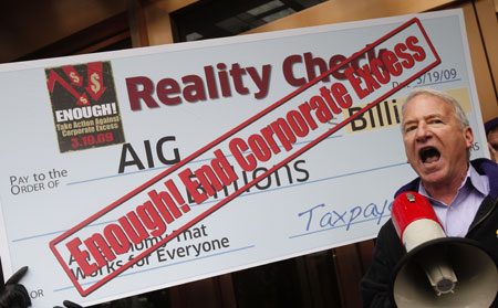 A protester takes part in a rally in front of an American International Group (AIG) office calling on Congress to take action on employee free choice, health care, and banking reform in Washington, March 19, 2009. [Xinhua/Reuters]