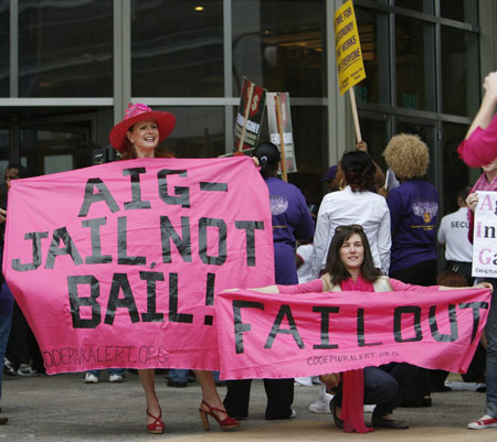 Members of the group 'Code Pink' protest outside the AIG building in Los Angeles March 19, 2009. The action was part of a national protest against major U.S. banks and firms with participants calling on Congress to take action on employee free choice, health care, and banking reform. [Xinhua/Reuters]