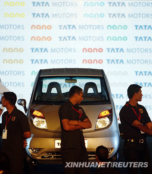 Tata Nano car is seen during the vehicle's launch in Mumbai on March 23, 2009. Tata Motors took the wraps off the world's cheapest car, showcasing the Nano that bosses hope will transform travel for millions of Indians at a glitzy, open-air launch. The basic model -- bookings for which open next month -- sells for just 100,000 rupees (2,000 USD). [Xinhua/AFP]