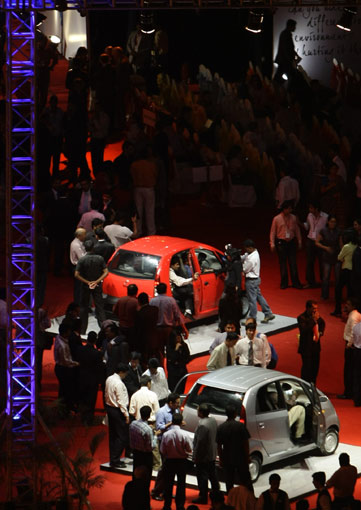 Tata Nano car is seen during the vehicle's launch in Mumbai on March 23, 2009. Tata Motors took the wraps off the world's cheapest car, showcasing the Nano that bosses hope will transform travel for millions of Indians at a glitzy, open-air launch. The basic model -- bookings for which open next month -- sells for just 100,000 rupees (2,000 USD). [Xinhua/AFP]