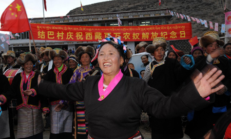 People of the Tibetan ethnic group hold a celebration for the upcoming Serfs Emancipation Day, at Jiaba Village of Nedong County, southwest China's Tibet Autonomous Region, March 23, 2009. [Xinhua photo]