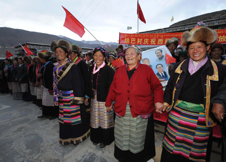 People of the Tibetan ethnic group hold a celebration for the upcoming Serfs Emancipation Day, at Jiaba Village of Nedong County, southwest China's Tibet Autonomous Region, March 23, 2009. [Xinhua photo]