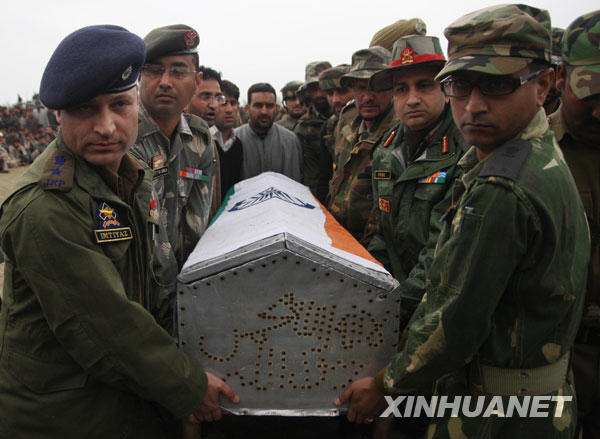 People carry a coffin containing the body of Shabir Ahmad Malik, a Kashmiri Muslim soldier of the Indian army, in Dab, 35 kilometers north of Srinagar, summer capital of Indian-controlled Kashmir, March 24, 2009. 