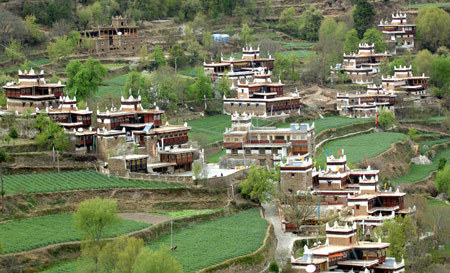 The picture taken on March 24, 2009 shows a beautiful view of Jiaju Tibetan Village in Tibetan Autonomous Prefecture of Garze in southwest China's Sichuan Province. With only 160 households, the Tibetan village has been a famous tourist attraction in recent years.