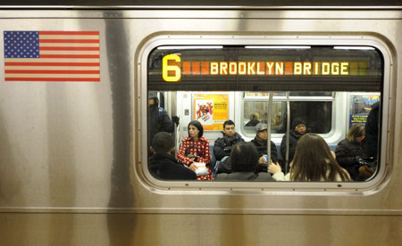 Passengers take the subway train in New York, the United States, March 24, 2009. [Gu Xinrong/Xinhua]