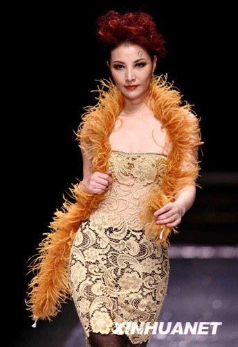 A model wears the new collection by designer Chen Juanhong during China International Fashion Week for fall winter 2009/10 in Beijing Wednesday, March 25 2009. 