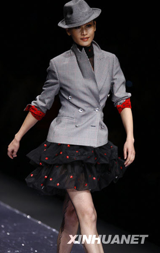 A model wears the new collection by designer Chen Juanhong during China International Fashion Week for fall winter 2009/10 in Beijing Wednesday, March 25 2009. 