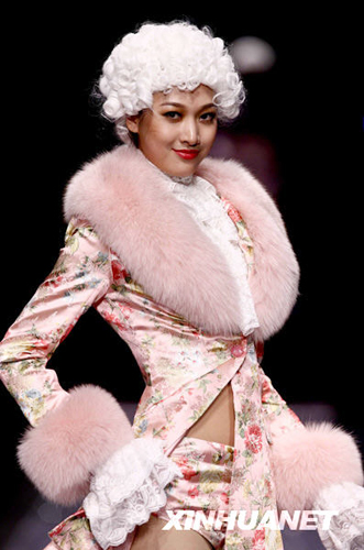 A model wears the new collection by designer Chen Juanhong during China International Fashion Week for fall winter 2009/10 in Beijing Wednesday, March 25 2009. 