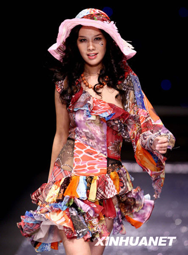 A model wears the new collection by designer Chen Juanhong during China International Fashion Week for fall winter 2009/10 in Beijing Wednesday, March 25 2009.