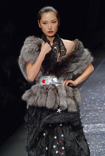 A model wears the new collection by designer Chen Juanhong during China International Fashion Week for fall winter 2009/10 in Beijing Wednesday, March 25 2009.